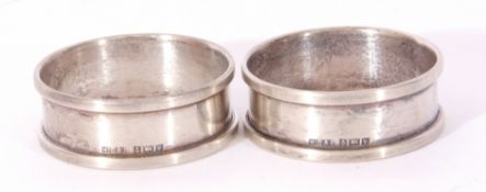 Mixed Lot: pair of Birmingham hallmarked napkin rings, together with two unengraved silver pendants,