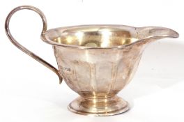 George V small silver jug with looped handle and a spreading circular foot, Sheffield 1930, maker'