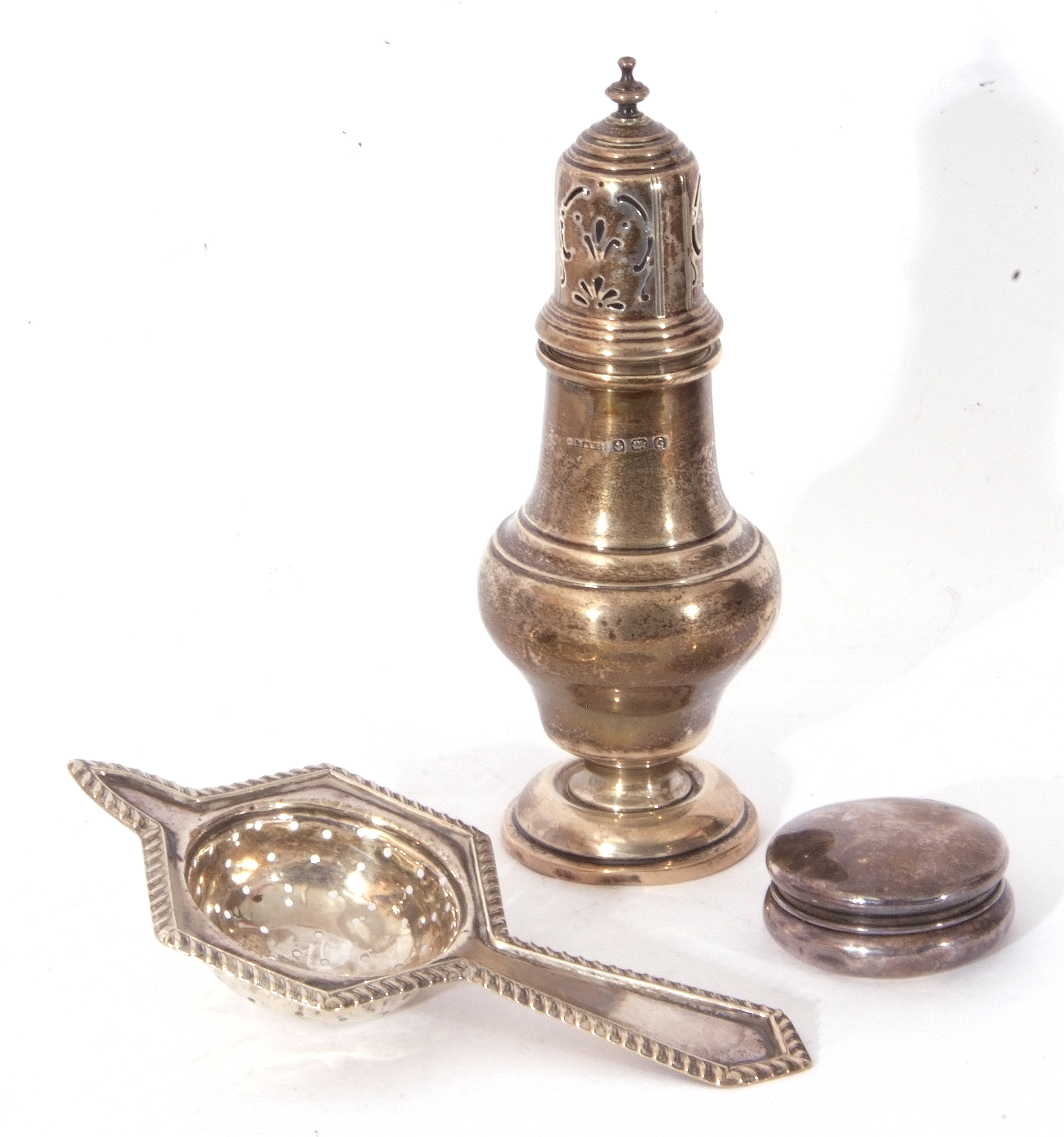 Mixed Lot: white metal hexagonal tea strainer, a Birmingham hallmarked baluster sugar sifter and a