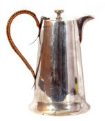 George V silver hot water jug of tapering cylindrical form fitted with a looped plain mounted handle