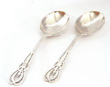 Pair of George VI silver serving spoons, the stems decorated with pierced foliate detail, makers