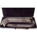 J Weiss & Son Ltd, Strand, London cased graduated set of white metal catheters in a hinged