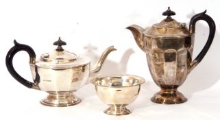 George V silver three piece tea set comprising tea pot with ebonised handle and hinged lid,