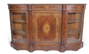 Victorian burr walnut and amboyna credenza, the central inlaid door flanked to each side by a curved