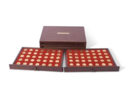 Danbury Mint mahogany cased two-drawer set of gold plated silver "medals" from Offa (757-796) to