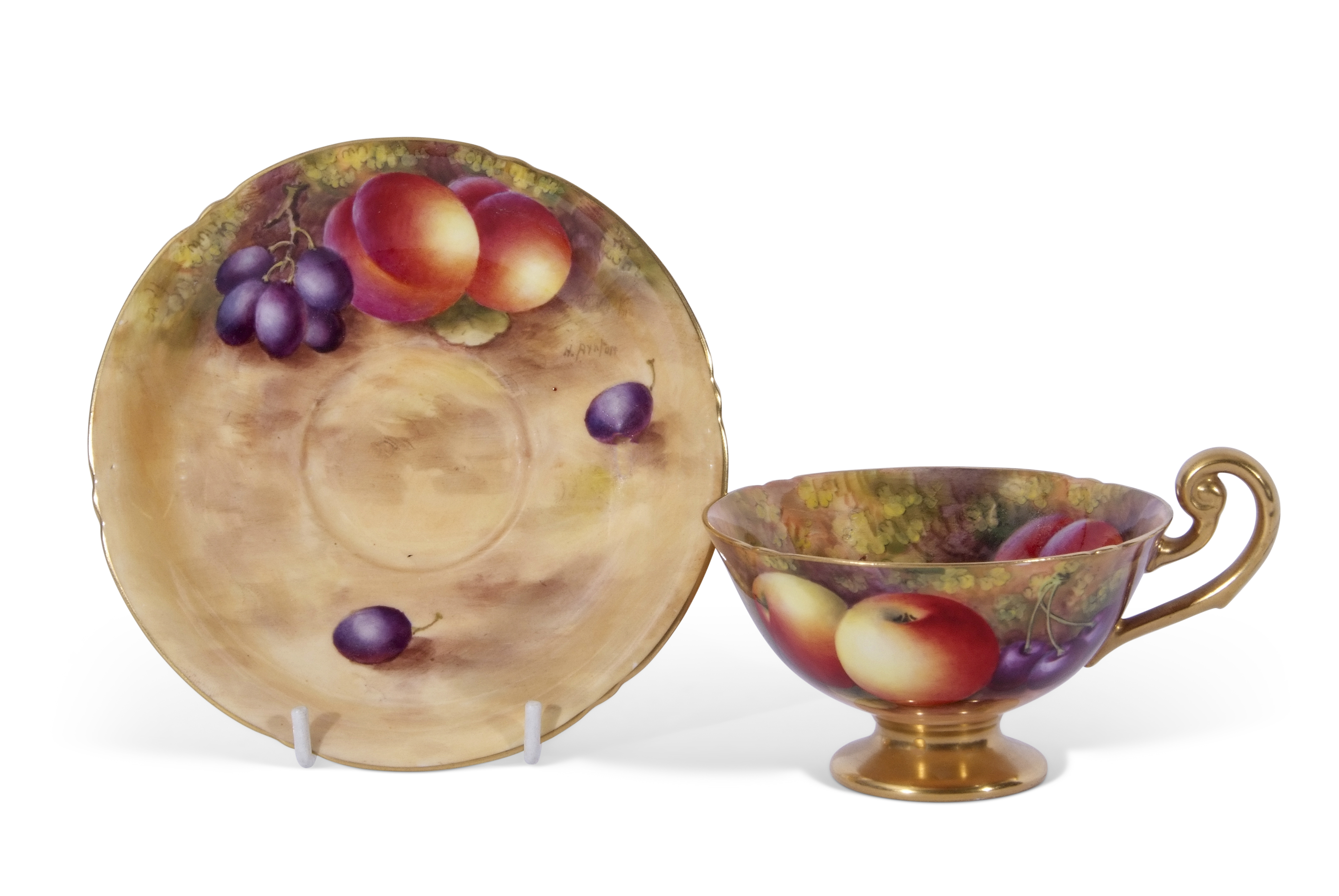 Royal Worcester cup and saucer, both decorated with fruit by Harry Ayrton, signature to cup and