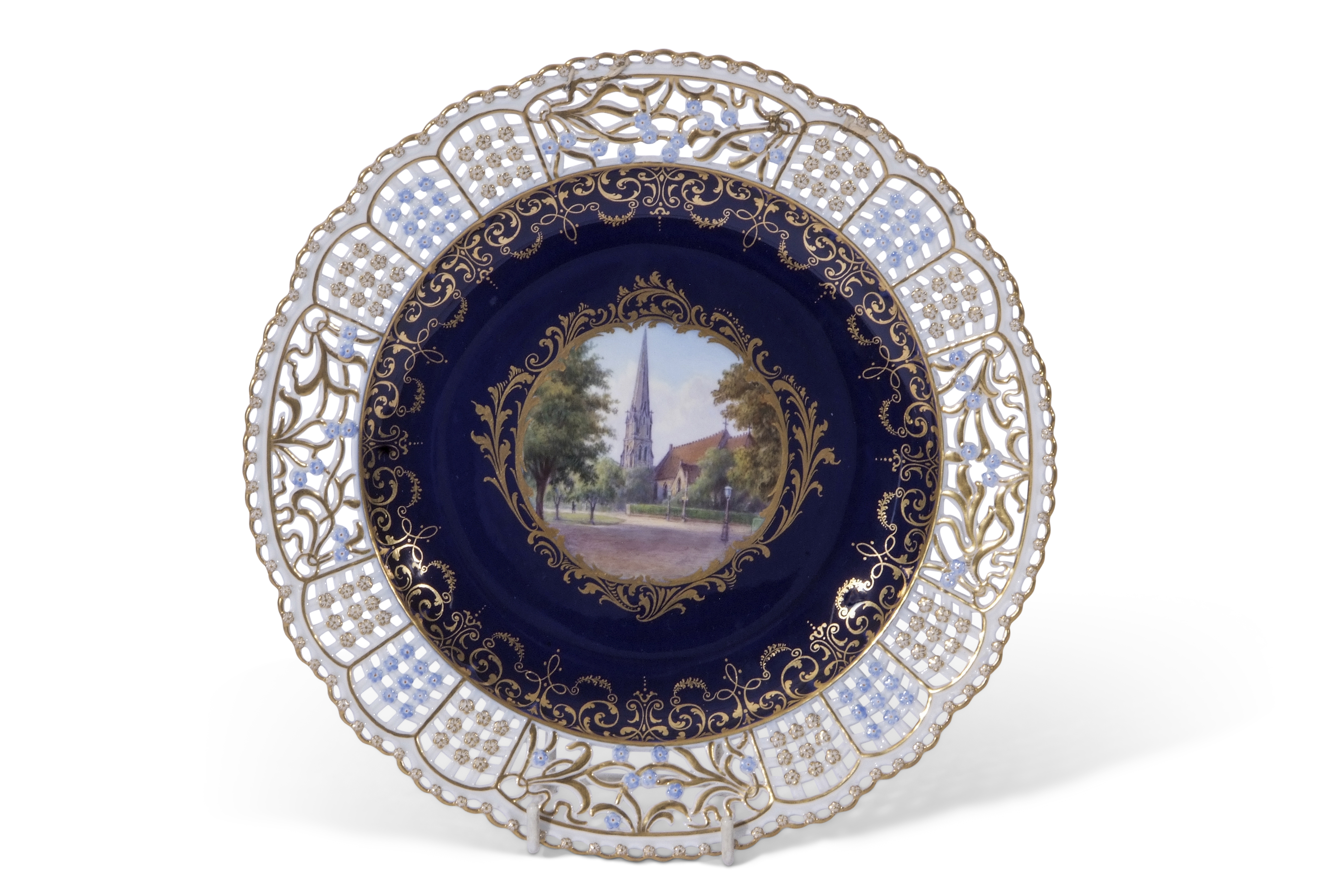 Late 19th century Meissen plate with reticulated border, the centre with a gilt cartouche