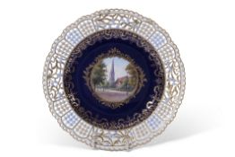 Late 19th century Meissen plate with reticulated border, the centre with a gilt cartouche