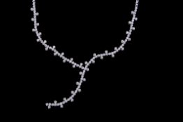 18ct white gold and diamond long centre drop necklet featuring 130 small diamonds in rub-over