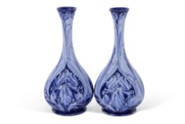 Good pair of early Moorcroft Florian ware vases, the pear shaped bodies with tube lined floral