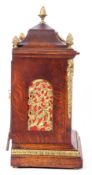 Late 19th century oak cased bracket clock, the case with applied floral metal mounts and a glazed
