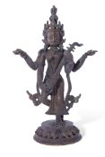 Bronzed figure of a Hindu deity on shaped base, 21cm high