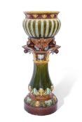 Late 19th century Doulton Lambeth jardiniere and stand in majolica glazes, the jardiniere with