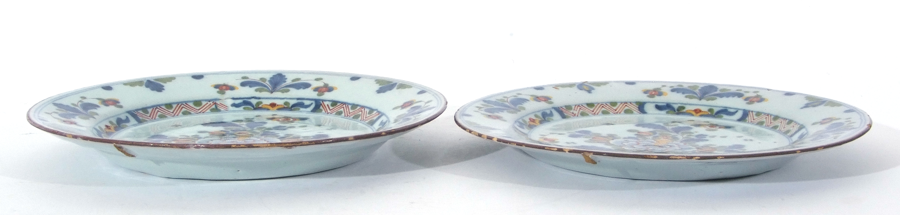 Pair of mid-18th century English Delft plates with polychrome design of flowers, probably Lambeth, - Image 2 of 3