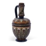 Stoneware Art pottery ewer of baluster form decorated with stylised foliate motifs in brown, green