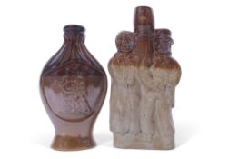 Salt glaze spirit flask of oval shape with flared base modelled with two figures with a tree