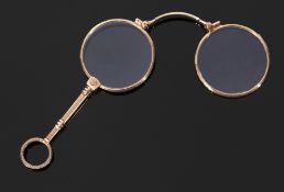 Pair of 19th century Continental folding lorgnettes with engraved handle and frames (the frames