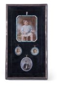 Interesting early 20th century set of four family portrait miniatures, the first within a silver