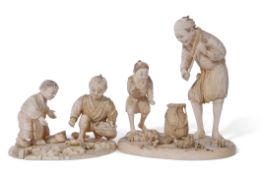 Two Japanese ivory okimono groups, Meiji period, one of a elderly man and young boy, on circular