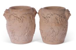 Pair of early 19th century terracotta barrel shaped wine coolers by Davenport, decorated with