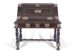 Large 19th century Ceylonese trunk on stand, top section with fall down front containing 8 small