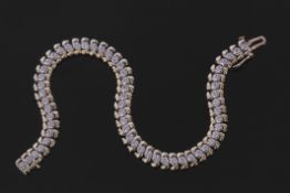 9ct gold diamond set line bracelet featuring 57 small diamonds, approx 1.5ct, each individually claw