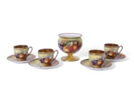 Group of four Japanese porcelain cups and saucers, all with hand painted fruit designs in