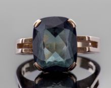 Tourmaline dress ring, of faceted rectangular shape, raised above split angular shoulders, stamped