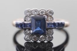 Sapphire and diamond cluster ring in Art Deco style, featuring a rectangular cut sapphire within a