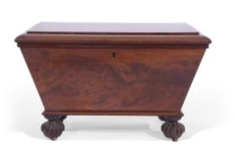 William IV mahogany wine cooler of sarcophagus form, supported on four fluted disc feet and