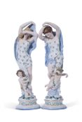 Pair of late 19th century Continental porcelain dancers modelled as ladies with cherubs at their