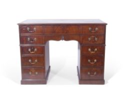 George III mahogany kneehole clerk's writing desk having a tooled leather insert top, the secretaire