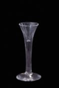 18th century wine glass with drawn trumpet bowl, folded foot (rim chips), 15cm high