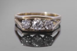 Three stone diamond ring featuring three graduated round brilliant cut diamonds, 0.50ct approx, each