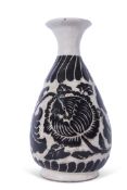 Interesting Chinese pottery vase of baluster shape, decorated in relief with a black design on white
