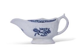 Lowestoft sauce boat, the body moulded with a fluted design, decorated in underglaze blue with