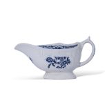 Lowestoft sauce boat, the body moulded with a fluted design, decorated in underglaze blue with