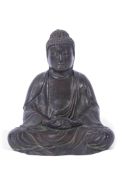 Bronze model of Buddha in typical pose, 19cm high