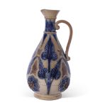 Large T Smith & Co pear-shaped jug, the buff body decorated with blue foliage in Lambeth Doulton