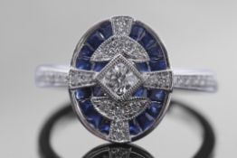 18ct white gold, sapphire and diamond plaque ring, the oval plaque 14 x 12mm centring a round