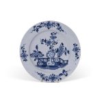 Lowestoft plate decorated in underglaze blue with a fence and flowering plants, 23cm diam (