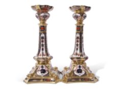 Large pair of Royal Crown Derby candlesticks in Imari and gilt design, factory mark to base with