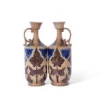 Good pair of J Smith & Co Art pottery jugs, the buff brown body with floral decoration in green,