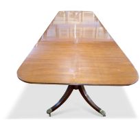 Arthur Brett & Son Norwich mahogany triple pedestal dining table in George III style, the top with