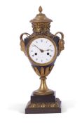 Faisant a Paris, a 19th century French ornate mantel clock, the case with pineapple terminal, vine