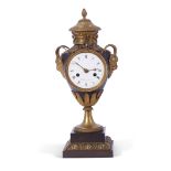 Faisant a Paris, a 19th century French ornate mantel clock, the case with pineapple terminal, vine