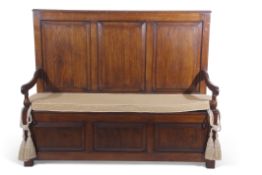 20th century oak settle with three panelled back and front seat, having scrolled arms, 152cm wide