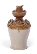 Stoneware money box impressed "Gertrude Hall 1887" modelled as a jug with rope handles, 20cm high