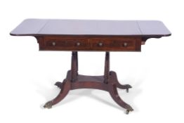 Late Regency period mahogany sofa table with two side drawers, opposite two dummy drawers, supported