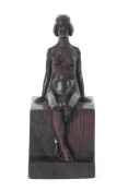Early 20th century carved oak figure of a seated female nude bearing the monogram WHT, 28cm high
